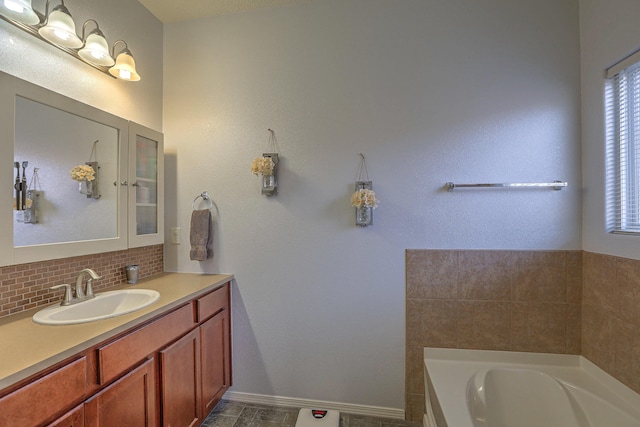 5679 Cold Creek Ave NW, Albuquerque, NM 87114 - full bath with vanity, decorative backsplash, and a bath