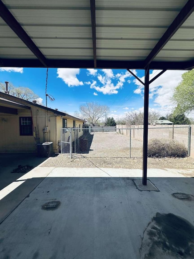 view of patio / terrace featuring fence and cooling unit