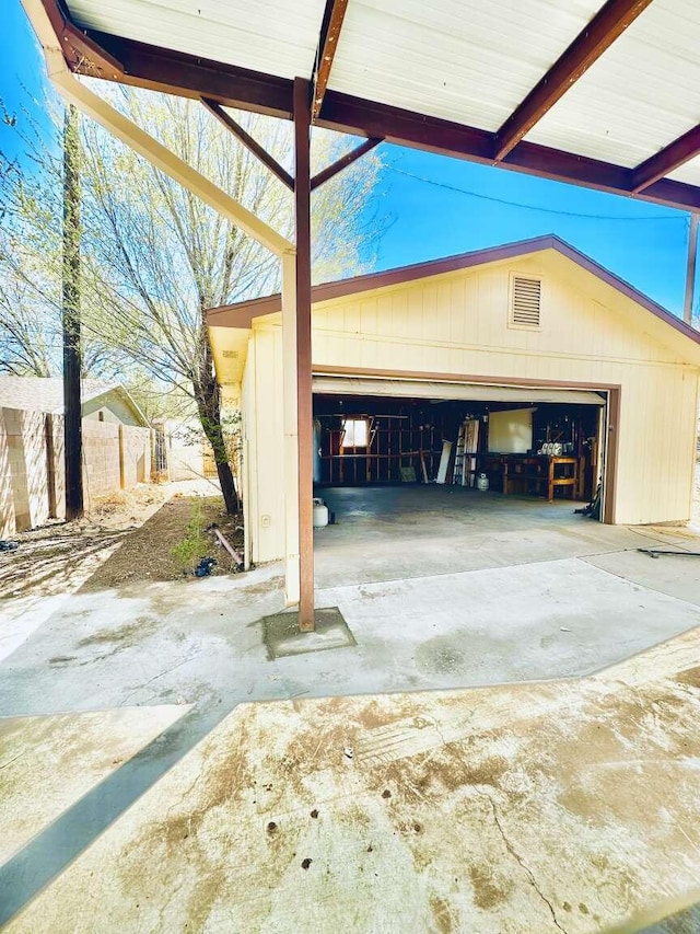 garage with fence