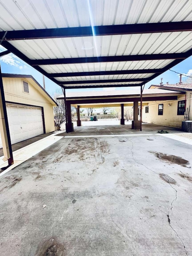 garage with central AC unit and visible vents