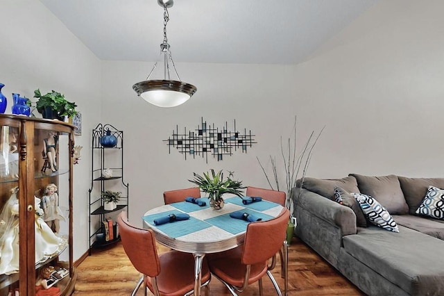 dining area featuring light wood finished floors