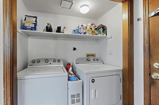 laundry room with washer and dryer and laundry area
