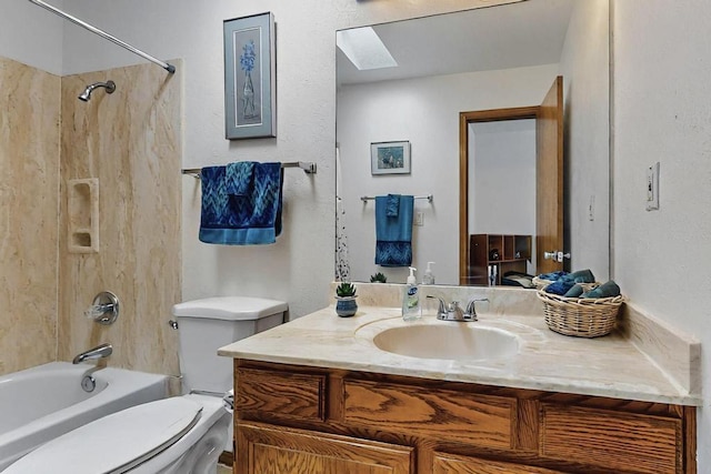 full bath with a skylight, vanity, toilet, and shower / washtub combination
