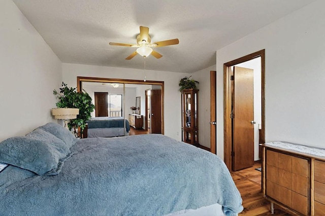bedroom featuring a ceiling fan, a closet, and light wood-type flooring