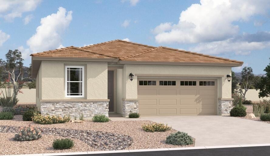view of front of property with stone siding, stucco siding, driveway, and a garage