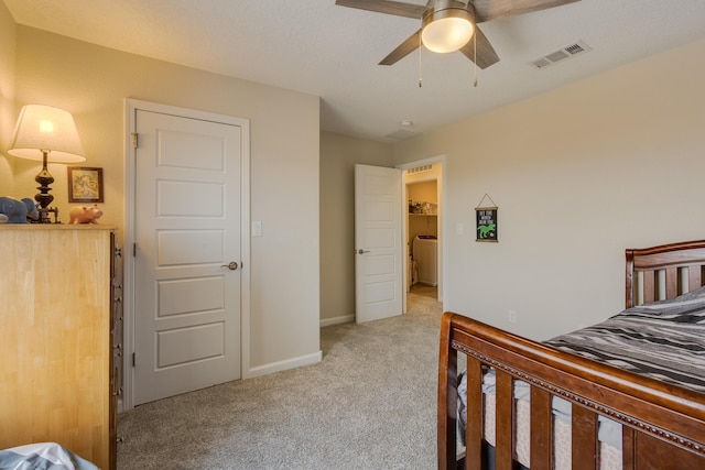 bedroom featuring visible vents, a ceiling fan, baseboards, and light carpet