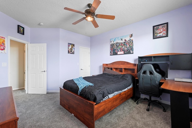 bedroom featuring baseboards, carpet flooring, a textured ceiling, and a ceiling fan