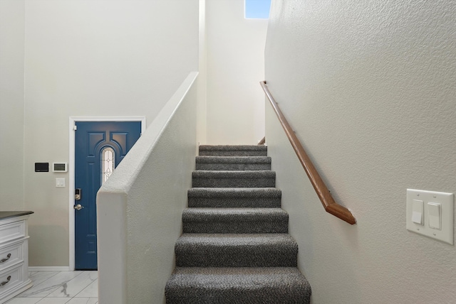 stairs with marble finish floor