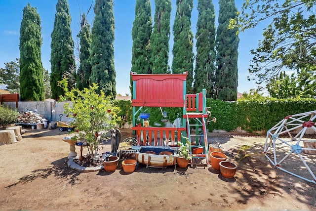 view of yard with a playground and fence