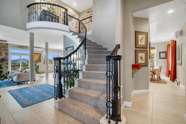 stairs with recessed lighting and baseboards