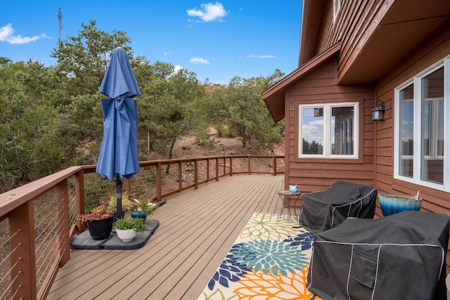 wooden terrace featuring grilling area