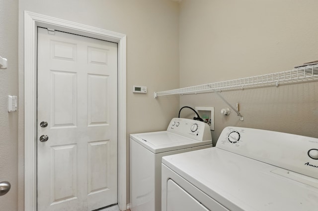 washroom with washer and dryer and laundry area