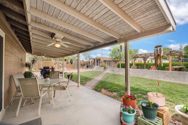 view of patio with a pergola, outdoor dining area, ceiling fan, and an outdoor structure
