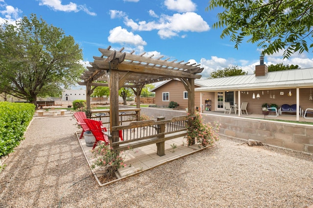 view of community featuring a patio area and a pergola