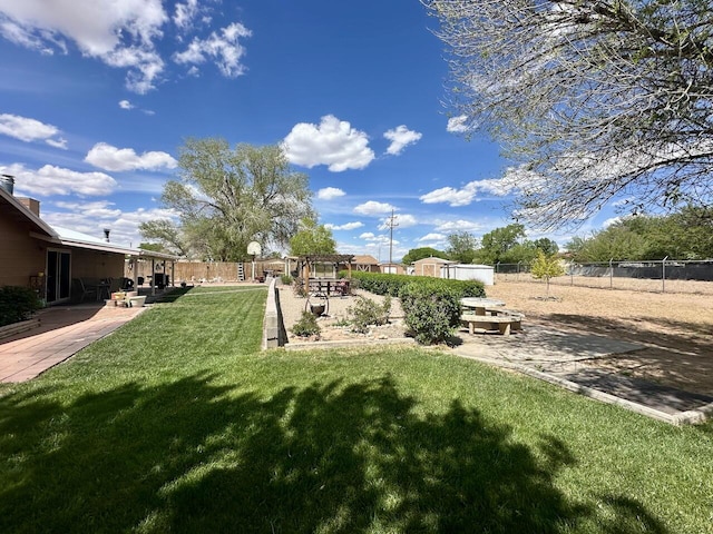 view of yard with fence and a patio area