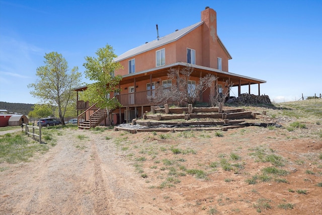 19 Sage Ct, Edgewood, NM 87015 - rear view of property with stairs and a chimney