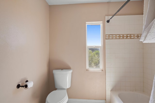 19 Sage Ct, Edgewood, NM 87015 - bathroom featuring toilet, baseboards, and tub / shower combination