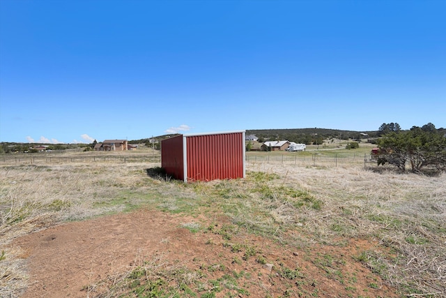 19 Sage Ct, Edgewood, NM 87015 - view of yard with a rural view, an outbuilding, and fence
