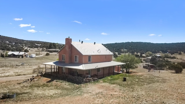 19 Sage Ct, Edgewood, NM 87015 - back of property with a chimney