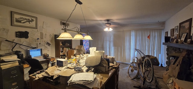 dining room with a ceiling fan and carpet
