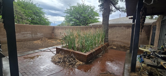 view of yard with a patio and fence