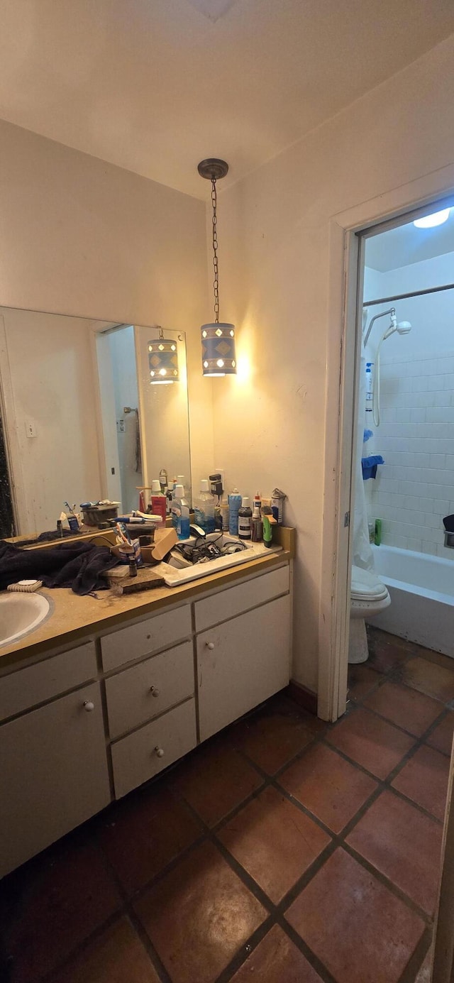 bathroom with toilet, a sink, tile patterned flooring, double vanity, and tub / shower combination