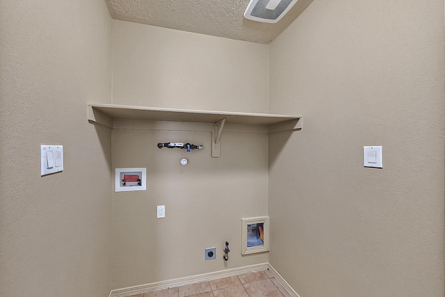 7229 Skagway Dr NE, Rio Rancho, NM 87144 - laundry room with gas dryer hookup, washer hookup, baseboards, electric dryer hookup, and tile patterned flooring