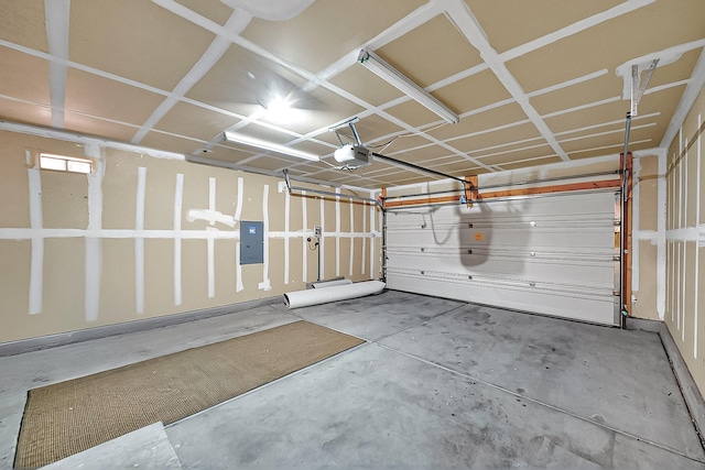 garage featuring electric panel and a garage door opener