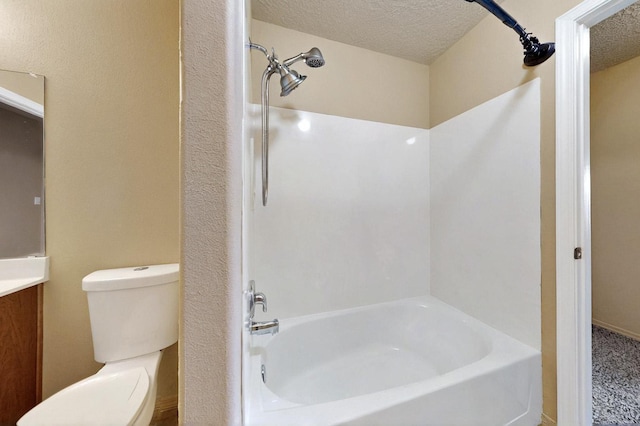 full bath with toilet, washtub / shower combination, a textured ceiling, and vanity