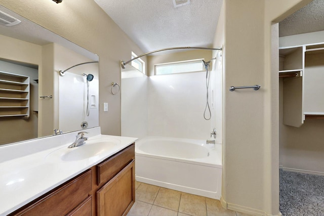 7229 Skagway Dr NE, Rio Rancho, NM 87144 - full bath with shower / bath combination, vanity, tile patterned floors, a textured ceiling, and a spacious closet