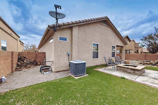 7229 Skagway Dr NE, Rio Rancho, NM 87144 - rear view of property with an outdoor fire pit, central AC unit, stucco siding, and a patio