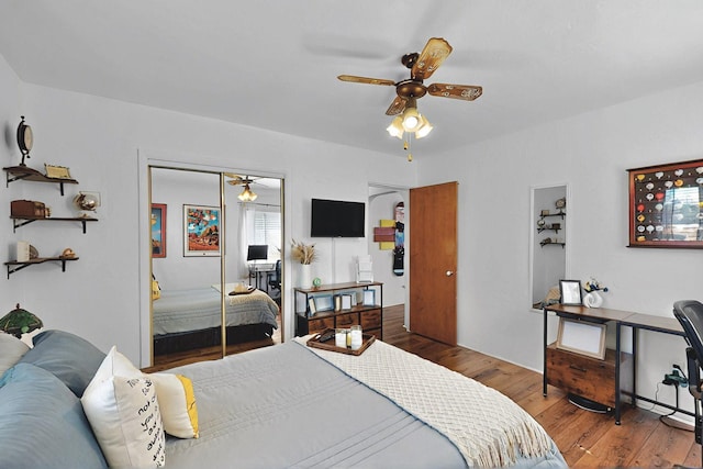 bedroom with a closet, ceiling fan, and wood finished floors