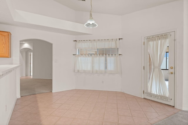 2105 Gila River Rd NE, Rio Rancho, NM 87144 - unfurnished room with arched walkways, light colored carpet, and baseboards