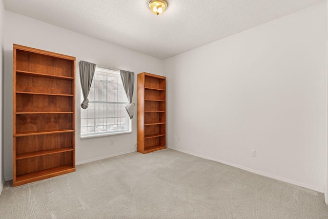 2105 Gila River Rd NE, Rio Rancho, NM 87144 - spare room with carpet floors, a textured ceiling, and baseboards