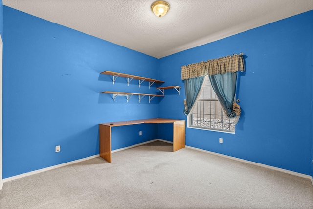 2105 Gila River Rd NE, Rio Rancho, NM 87144 - spare room with carpet, a textured ceiling, and baseboards