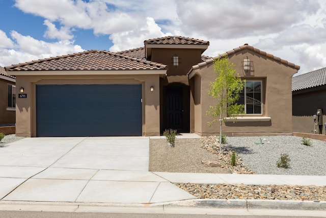 6791 Sydney Dr NE, Rio Rancho, NM 87144 - mediterranean / spanish home featuring stucco siding, a garage, driveway, and a tiled roof
