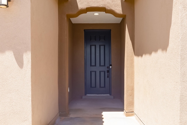6791 Sydney Dr NE, Rio Rancho, NM 87144 - property entrance featuring stucco siding