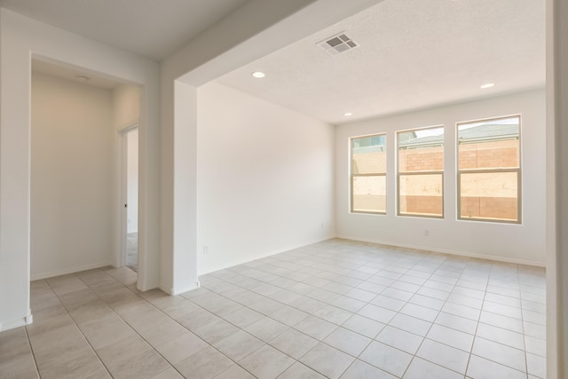 6791 Sydney Dr NE, Rio Rancho, NM 87144 - empty room featuring light tile patterned floors, recessed lighting, and baseboards