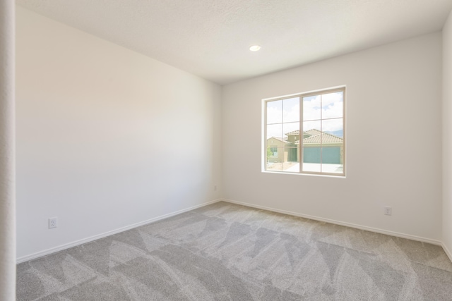 6791 Sydney Dr NE, Rio Rancho, NM 87144 - empty room with light carpet, baseboards, and recessed lighting