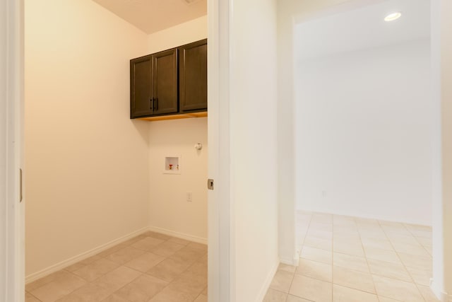 6791 Sydney Dr NE, Rio Rancho, NM 87144 - laundry area with cabinet space, washer hookup, light tile patterned floors, recessed lighting, and baseboards