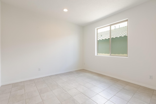 6791 Sydney Dr NE, Rio Rancho, NM 87144 - spare room with baseboards, recessed lighting, and light tile patterned floors