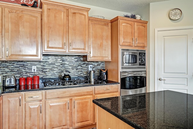 15 Los Miradores Dr NE, Rio Rancho, NM 87124 - kitchen featuring stainless steel appliances, tasteful backsplash, dark stone counters, and light brown cabinets