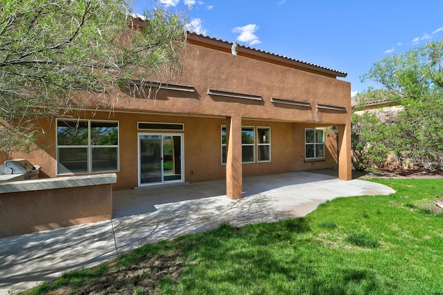 15 Los Miradores Dr NE, Rio Rancho, NM 87124 - rear view of property with stucco siding, a lawn, a patio area, and a tile roof