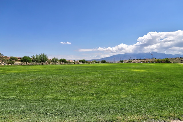 15 Los Miradores Dr NE, Rio Rancho, NM 87124 - surrounding community featuring a mountain view, a yard, and a view of countryside