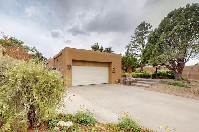 13108 Della Longa Ln NE, Albuquerque, NM 87111 - garage featuring driveway