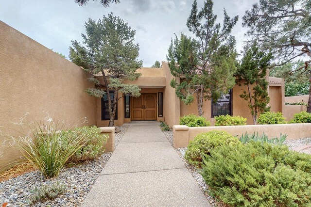 13108 Della Longa Ln NE, Albuquerque, NM 87111 - property entrance featuring stucco siding