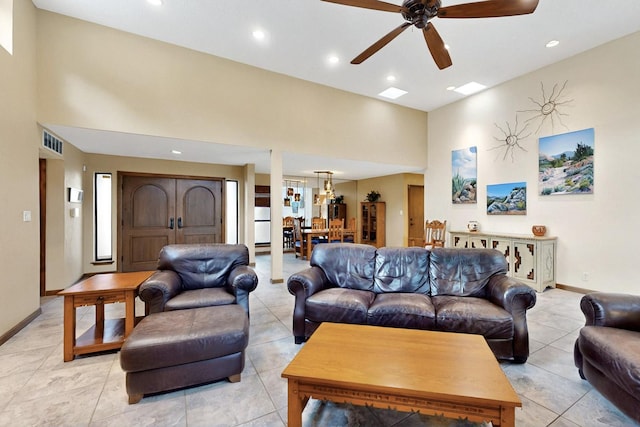 13108 Della Longa Ln NE, Albuquerque, NM 87111 - living area with ceiling fan, a high ceiling, recessed lighting, baseboards, and light tile patterned floors
