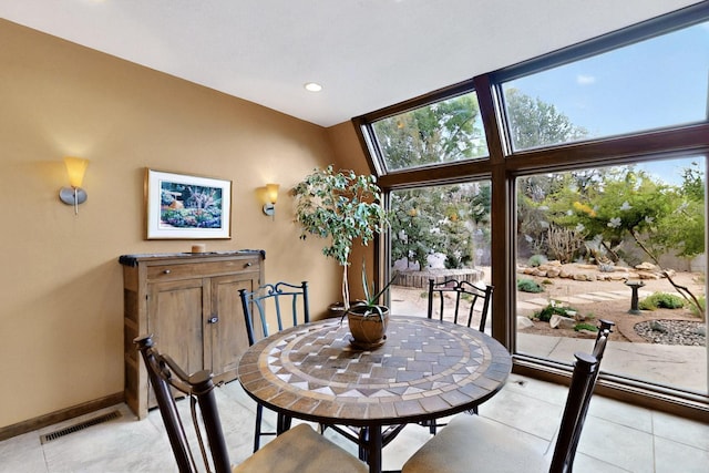 13108 Della Longa Ln NE, Albuquerque, NM 87111 - dining space with light tile patterned floors, baseboards, and recessed lighting