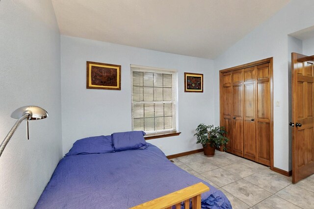 13108 Della Longa Ln NE, Albuquerque, NM 87111 - bedroom featuring baseboards, a closet, and light tile patterned floors