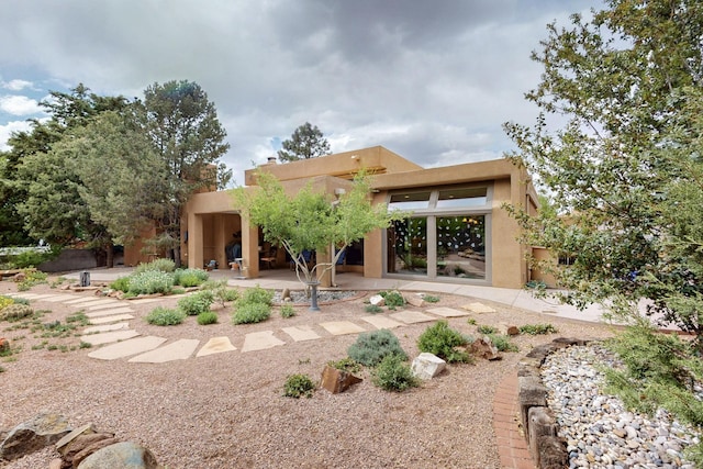 13108 Della Longa Ln NE, Albuquerque, NM 87111 - rear view of property with a patio area and stucco siding